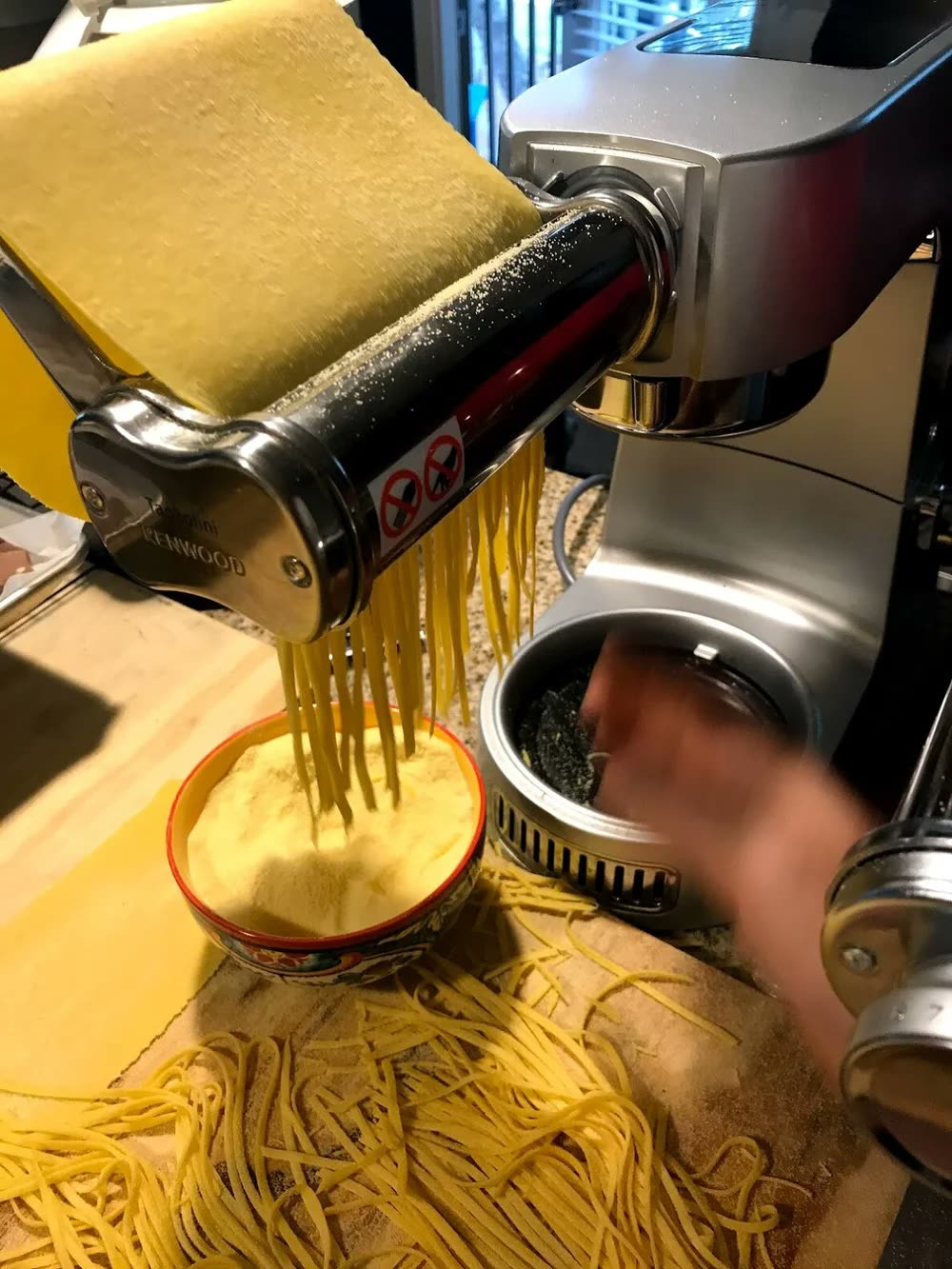 Fresh pasta coming off the pasta machine