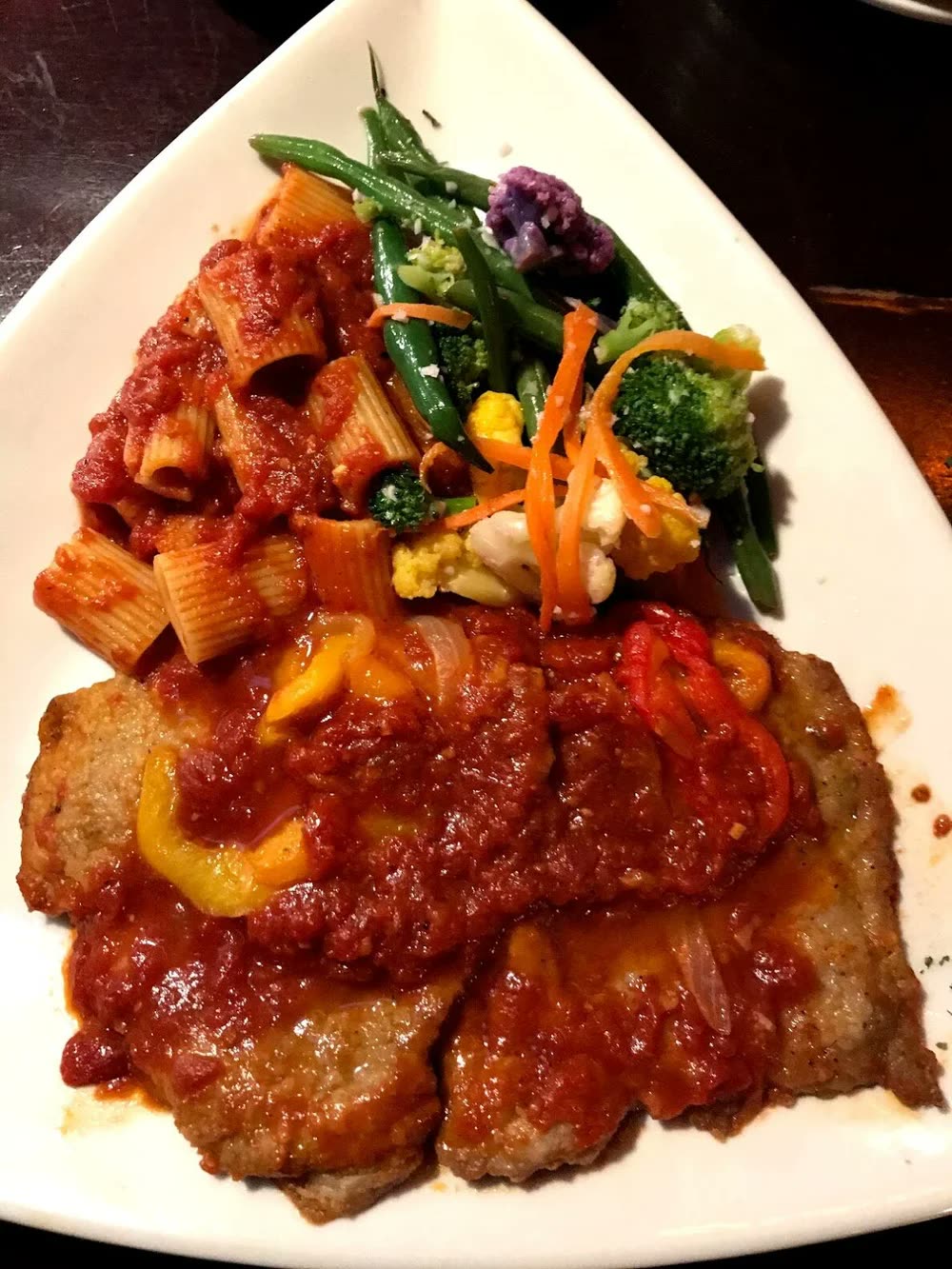Rigatoni in tomato sauce over veal pizzaiola